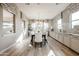 Sun-lit dining room features stylish seating, modern lighting, and a built in serving bar at 2351 E Cherrywood Pl, Chandler, AZ 85249