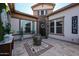 Welcoming front entrance featuring a water feature, stone pavers, and decorative 'Home' sign at 2351 E Cherrywood Pl, Chandler, AZ 85249