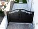 Wrought iron double front gate with decorative scrollwork accents and light gray pavers at 2351 E Cherrywood Pl, Chandler, AZ 85249