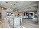 Bright open kitchen featuring a large island, modern appliances, and seamless flow to the living room at 2351 E Cherrywood Pl, Chandler, AZ 85249