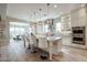 Modern kitchen with a large island, pendant lighting, and stainless steel appliances at 2351 E Cherrywood Pl, Chandler, AZ 85249