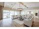 Bright and airy living room boasts large windows, neutral décor, and an open floor plan at 2351 E Cherrywood Pl, Chandler, AZ 85249