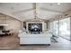 Open concept living room with vaulted ceilings, custom shelving, and modern furnishings at 2351 E Cherrywood Pl, Chandler, AZ 85249