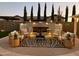 Stylish outdoor living area with fireplace, zebra rug, and comfortable seating at 2351 E Cherrywood Pl, Chandler, AZ 85249