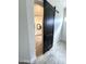 Charming bathroom with a sliding barn door, white vanity, and elegant fixtures adding character to the home at 2552 E Silverwood Dr, Phoenix, AZ 85048