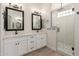 Bathroom featuring double vanity, modern fixtures, and glass enclosed shower at 2552 E Silverwood Dr, Phoenix, AZ 85048