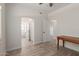 Bedroom features modern flooring, ensuite bath with an arched doorway, plus a separate doorway to the rest of the home at 2552 E Silverwood Dr, Phoenix, AZ 85048