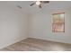 Inviting bedroom with neutral walls, new hardwood floors, and a ceiling fan to add more character at 2552 E Silverwood Dr, Phoenix, AZ 85048