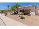 Single-story home featuring desert landscaping, a palm tree, and a beige exterior with a tile roof at 2552 E Silverwood Dr, Phoenix, AZ 85048