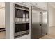 Gourmet kitchen features stainless steel appliances including double oven and fridge at 2552 E Silverwood Dr, Phoenix, AZ 85048