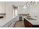 Spacious kitchen with white cabinets, stainless steel appliances, and contrasting island at 2552 E Silverwood Dr, Phoenix, AZ 85048