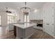 Modern kitchen featuring white cabinetry, a center island, and stainless steel appliances at 2552 E Silverwood Dr, Phoenix, AZ 85048