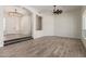 Spacious living area featuring modern lighting, two steps and beautiful flooring at 2552 E Silverwood Dr, Phoenix, AZ 85048