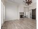 Living room with wood floors, fireplace and barn door leading to closet at 2552 E Silverwood Dr, Phoenix, AZ 85048