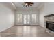 Bright living room with wood floors, fireplace and modern ceiling fan at 2552 E Silverwood Dr, Phoenix, AZ 85048