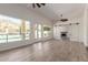 Large living room with a view of the fireplace and backyard swimming pool at 2552 E Silverwood Dr, Phoenix, AZ 85048
