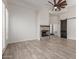 Living room with wood floors, fireplace and closet at 2552 E Silverwood Dr, Phoenix, AZ 85048