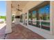 Comfortable covered patio area with outdoor seating and serene views of the backyard and desert landscape at 2552 E Silverwood Dr, Phoenix, AZ 85048