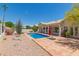 Inviting backyard pool with a neutral tile patio and a covered outdoor space for relaxing or entertaining at 2552 E Silverwood Dr, Phoenix, AZ 85048