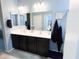 Bathroom featuring a dual sink vanity, lots of space and ample lighting at 25935 W Potter Dr, Buckeye, AZ 85396