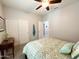 Bright bedroom featuring a ceiling fan and large closet at 25935 W Potter Dr, Buckeye, AZ 85396