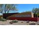 The Festival Foothills community sign on a stone wall and desert landscaping on a sunny day at 25935 W Potter Dr, Buckeye, AZ 85396