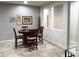 Dining room with a dark table, chairs, and decorative art at 25935 W Potter Dr, Buckeye, AZ 85396