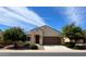 Charming single-story home with a well-manicured lawn and a two-car garage at 25935 W Potter Dr, Buckeye, AZ 85396