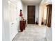 Well-lit hallway features tile flooring and stylish decor at 25935 W Potter Dr, Buckeye, AZ 85396