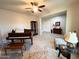 Comfortable living room showcasing a piano and curated decor at 25935 W Potter Dr, Buckeye, AZ 85396