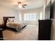 Serene main bedroom with plantation shutters, ceiling fan, and a comfortable king bed at 25935 W Potter Dr, Buckeye, AZ 85396