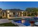 Serene backyard oasis with a pool, outdoor seating, lush greenery, and elegant architecture, perfect for relaxation at 26099 N 88Th Way, Scottsdale, AZ 85255