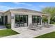 Backyard patio featuring modern lounge chairs, sleek doors, and manicured landscaping, creating a luxurious outdoor space at 26099 N 88Th Way, Scottsdale, AZ 85255