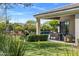 Enjoy outdoor living with covered patio, BBQ area, lush landscaping, and private pool, all in a putting green setting at 26099 N 88Th Way, Scottsdale, AZ 85255
