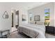 Serene bedroom with neutral tones, natural light, minimalist decor, and a comfortable queen bed at 26099 N 88Th Way, Scottsdale, AZ 85255