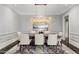 Elegant dining room features a modern chandelier and neutral color scheme at 26099 N 88Th Way, Scottsdale, AZ 85255