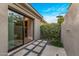 Exterior patio featuring an outdoor shower surrounded by greenery, concrete tiles, and stone at 26099 N 88Th Way, Scottsdale, AZ 85255