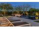 Beautiful backyard featuring a pool, spa, fire pit, and outdoor seating, perfect for entertaining and enjoying the outdoors at 26099 N 88Th Way, Scottsdale, AZ 85255