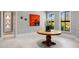Bright foyer featuring tile floors, elegant wainscoting, and a round wood table at 26099 N 88Th Way, Scottsdale, AZ 85255