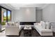Bright living room with modern fireplace and dark hardwood flooring at 26099 N 88Th Way, Scottsdale, AZ 85255