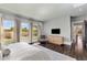 Spacious main bedroom with large windows, a dresser, and backyard views at 26099 N 88Th Way, Scottsdale, AZ 85255