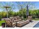 Cozy outdoor seating area with a fire pit, comfortable furniture, and elegant patio heaters, perfect for outdoor gatherings at 26099 N 88Th Way, Scottsdale, AZ 85255