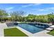 Inviting pool area with waterfall feature, integrated spa, and lounge seating, perfect for outdoor relaxation and entertainment at 26099 N 88Th Way, Scottsdale, AZ 85255