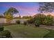A nice backyard putting green for enjoying time with friends at dusk at 26099 N 88Th Way, Scottsdale, AZ 85255