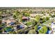 Aerial view showing a large lot with lush landscaping, sport court, and a sparkling pool at 2641 E Birchwood Pl, Chandler, AZ 85249
