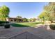Expansive backyard with gravel area, lush lawn and mature trees, offering privacy and natural beauty at 2641 E Birchwood Pl, Chandler, AZ 85249