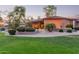 A spacious yard featuring lush greenery, desert landscaping, and mature trees, creating a serene outdoor retreat at 2641 E Birchwood Pl, Chandler, AZ 85249