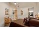Bedroom features neutral walls, ceiling fan, wood bench and access to an ensuite bathroom at 2641 E Birchwood Pl, Chandler, AZ 85249