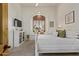 Cozy bedroom featuring a window seat, modern TV, and neutral decor at 2641 E Birchwood Pl, Chandler, AZ 85249