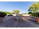 Cozy outdoor firepit with built-in seating, perfect for entertaining guests and enjoying cooler evenings at 2641 E Birchwood Pl, Chandler, AZ 85249